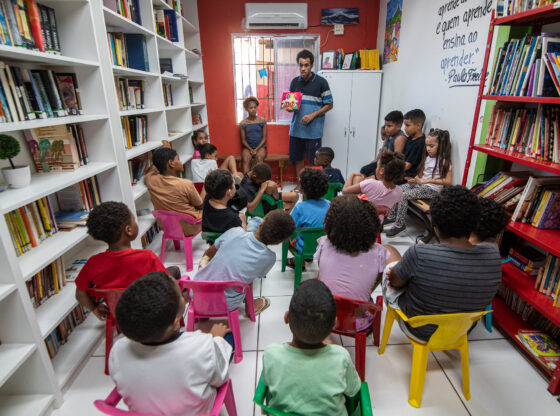 Jeferson Dias, Member of the Cerro Corá Residents in Motion Collective, Leads A Storytelling Session for About 20 Children at the Cerro Corá Community Library. Photo: Barbara Dias